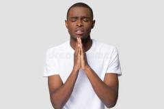 religious-black-guy-praying-hope-isolated-studio-background-worried-young-african-american-man-put-hands-together-ask-138433521